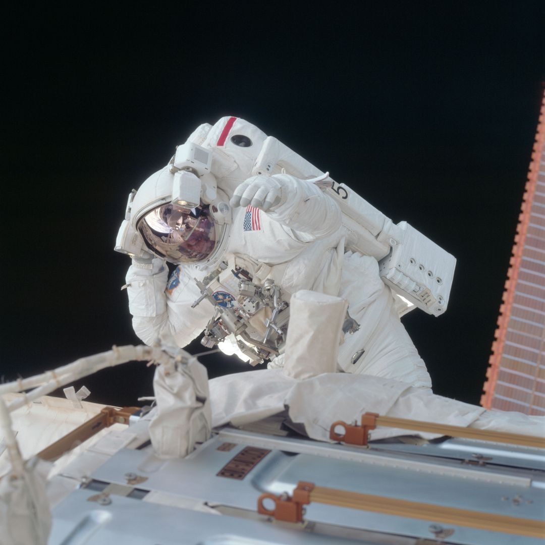 Astronaut Fixing Space Station During EVA in Zero Gravity - Free Images, Stock Photos and Pictures on Pikwizard.com