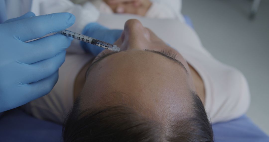 Woman Receiving Cosmetic Injection in Clinic - Free Images, Stock Photos and Pictures on Pikwizard.com