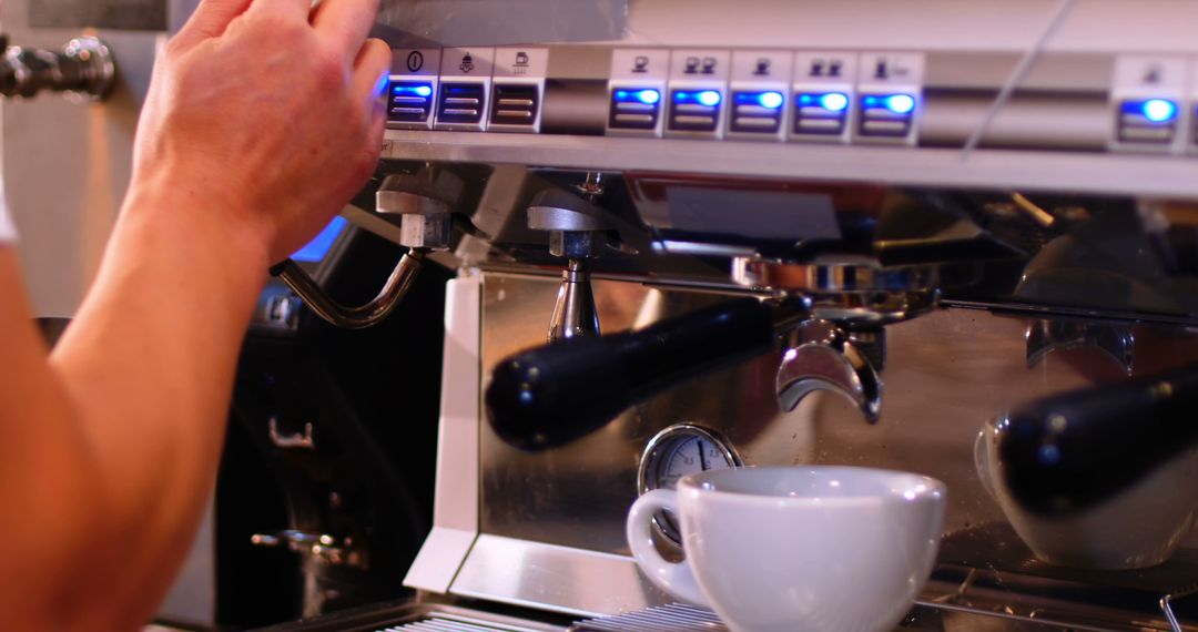 Barista Preparing Coffee with Espresso Machine in Cafe - Free Images, Stock Photos and Pictures on Pikwizard.com