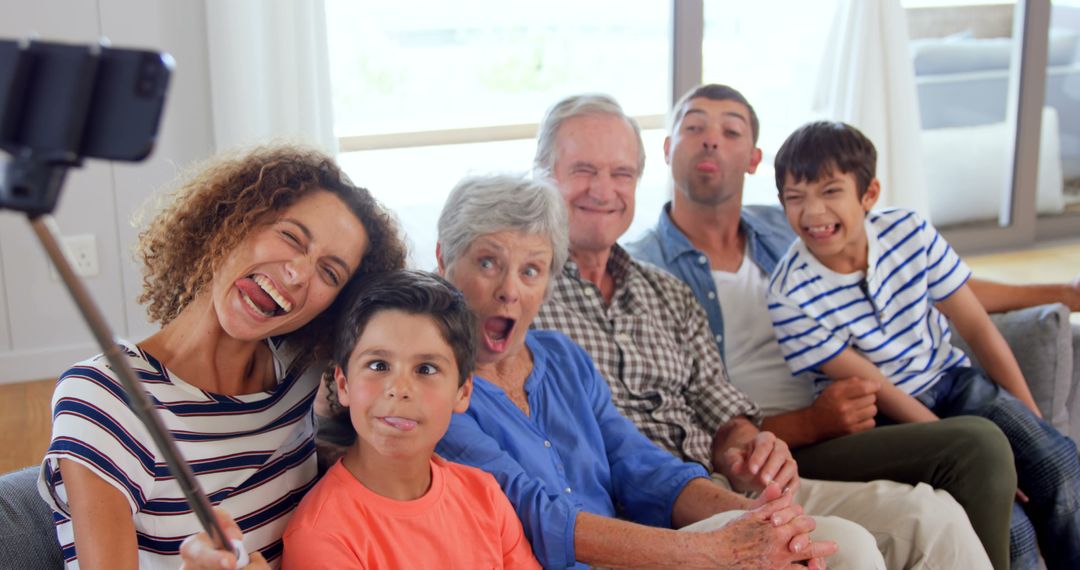 Cheerful Multigenerational Family Taking a Fun Selfie Indoors - Free Images, Stock Photos and Pictures on Pikwizard.com