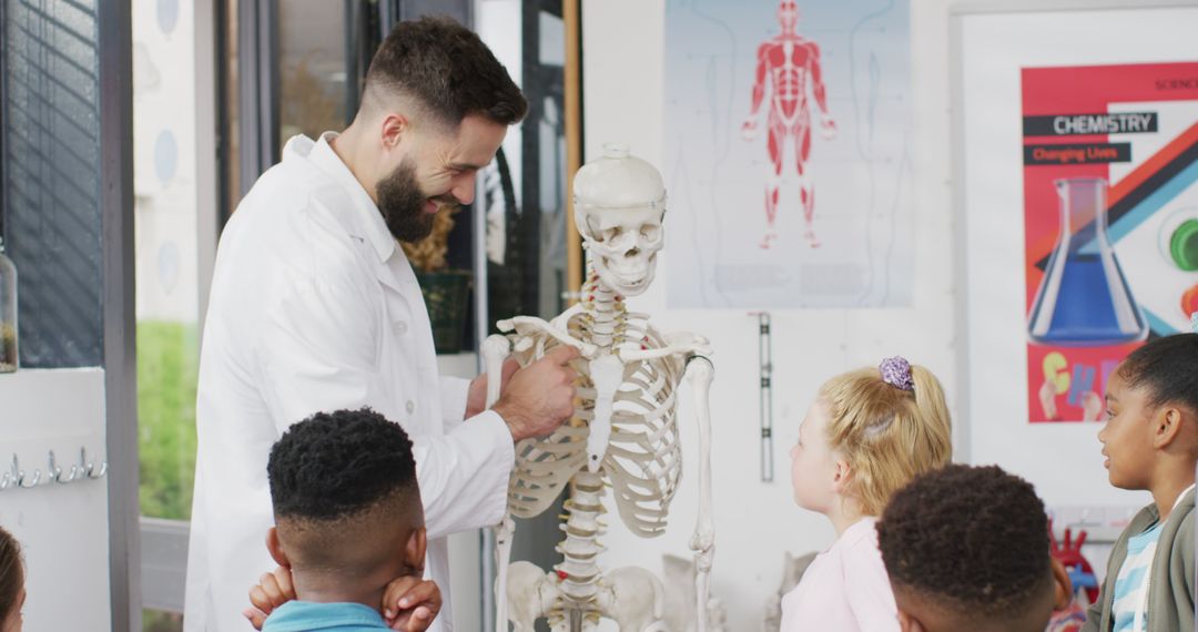 Male Teacher Explaining Human Skeleton to Students in Classroom - Free Images, Stock Photos and Pictures on Pikwizard.com