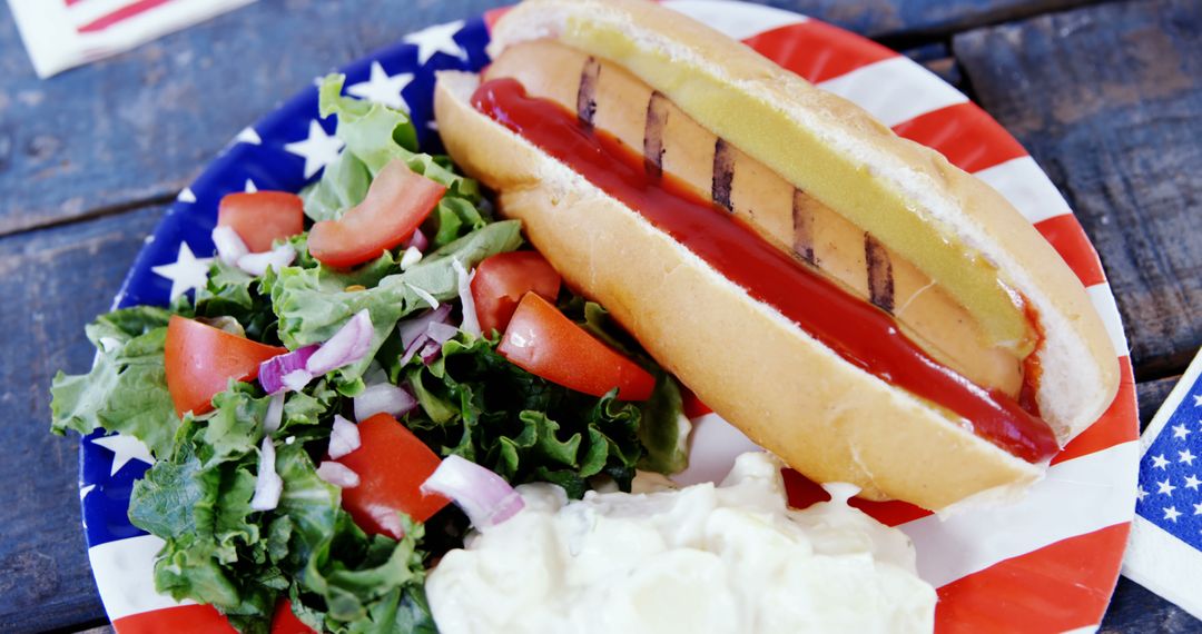 Patriotic Hot Dog and Fresh Salads for Independence Day Celebration - Free Images, Stock Photos and Pictures on Pikwizard.com