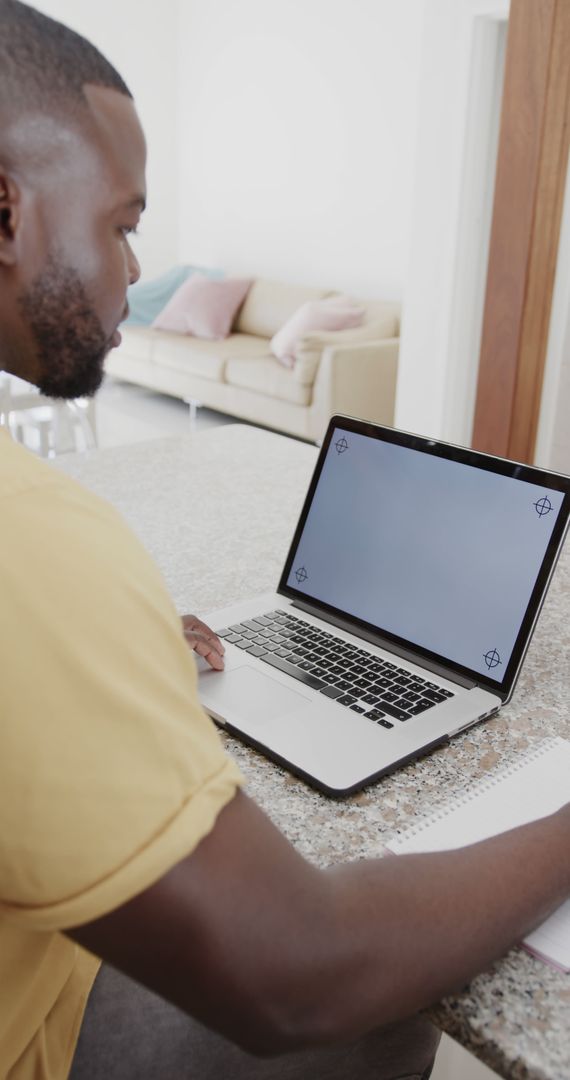 African-American Man Working on Laptop from Home - Free Images, Stock Photos and Pictures on Pikwizard.com