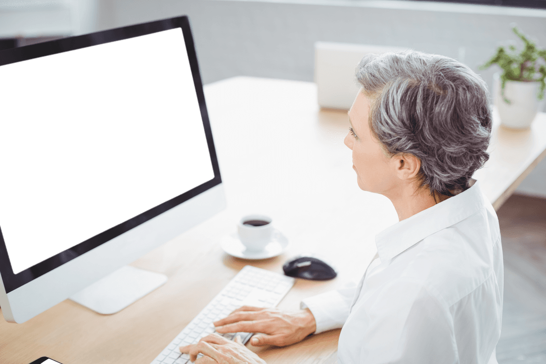 Elderly Woman Using Computer at Home with Transparent Screen