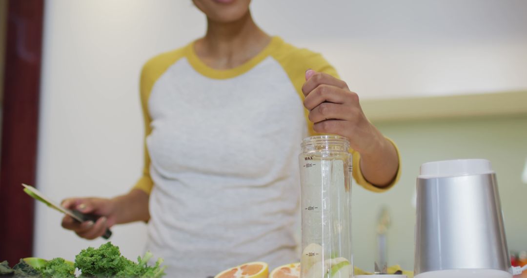 Woman Preparing Healthy Smoothie in Kitchen - Free Images, Stock Photos and Pictures on Pikwizard.com