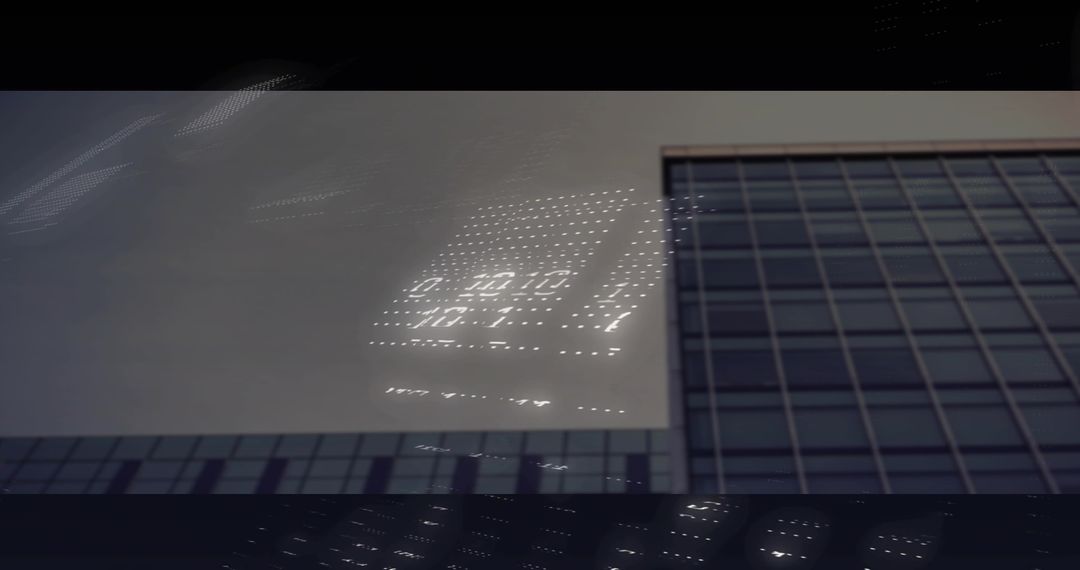 Reflecting LED Grid on Glass Facade of Modern High-Rise, Minimalist Urban Architecture