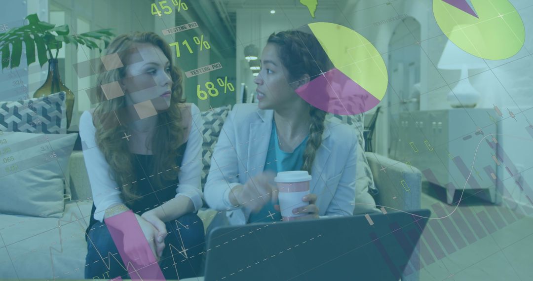 Businesswomen Collaborating in Modern Office with Data Visualization