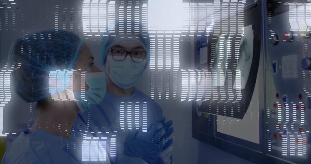 Surgeons Analyzing Data on Wall Monitor in Sterile Operating Room