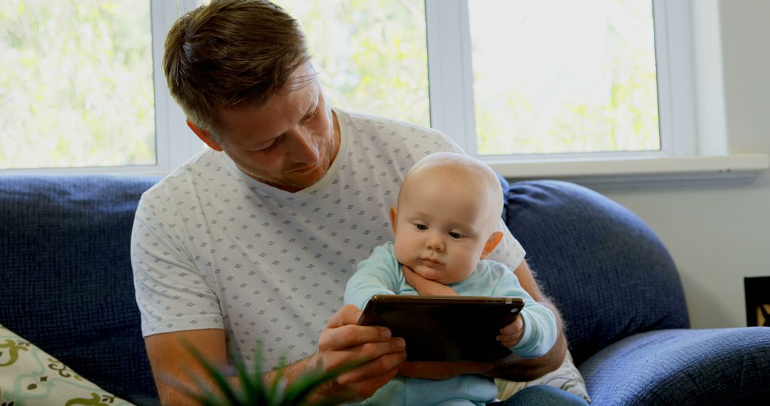 Father Bonding with Baby Using Tablet Technology Indoors - Free Images, Stock Photos and Pictures on Pikwizard.com