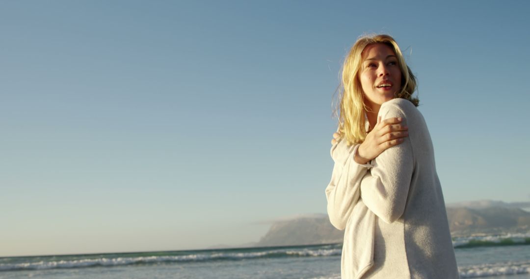 Cheerful Woman Enjoying Peaceful Beach Landscape - Free Images, Stock Photos and Pictures on Pikwizard.com