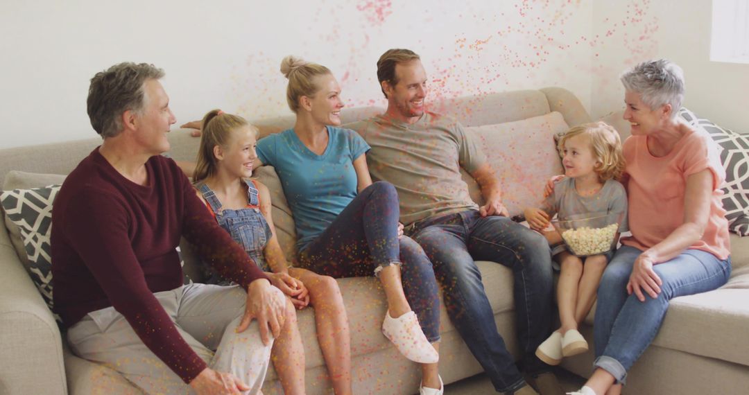 Multi-generational Family Relaxing with Popcorn and Confetti Celebration