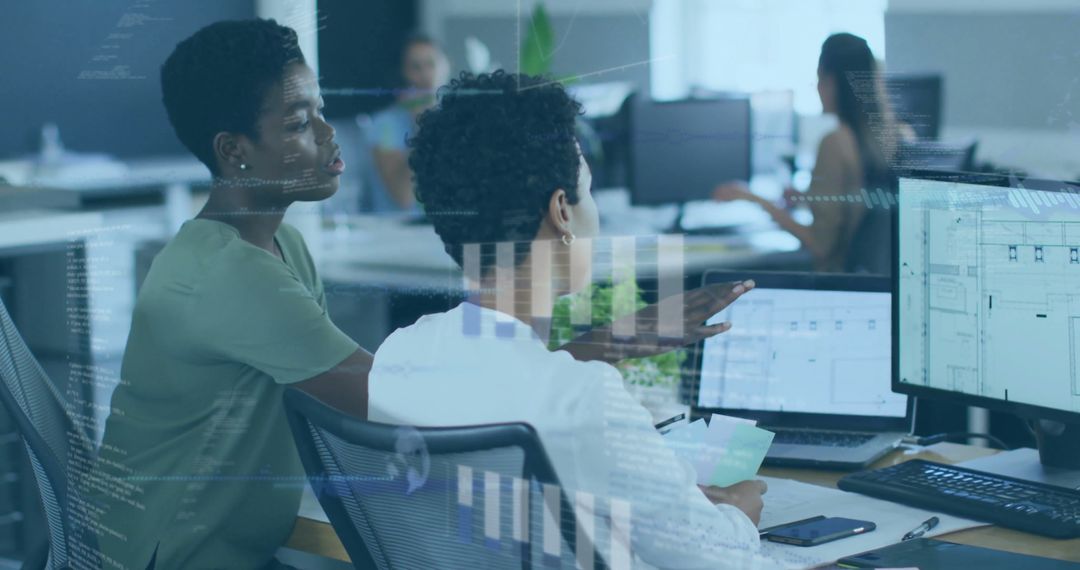 Diverse Professionals Analyzing Data on Computer Screens