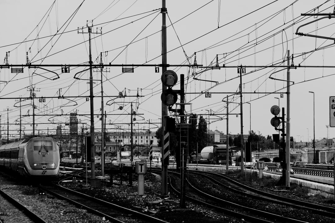 Urban Train Tracks with Overhead Power Lines in Black and White - Free Images, Stock Photos and Pictures on Pikwizard.com