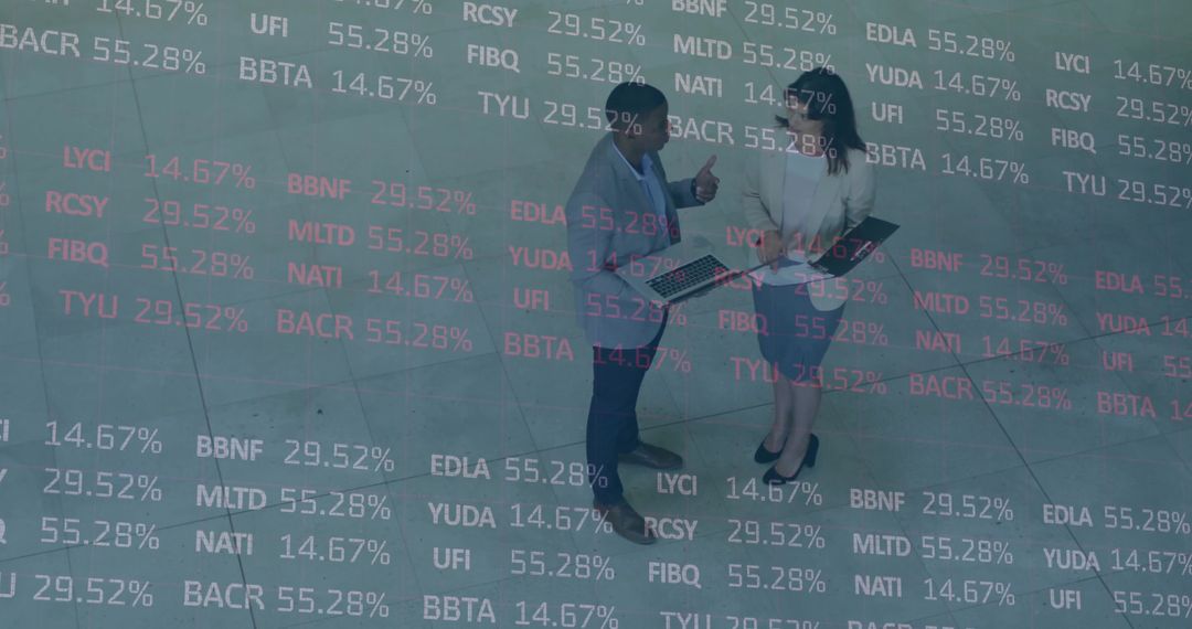 Business Professionals Collaborate with Financial Data Display