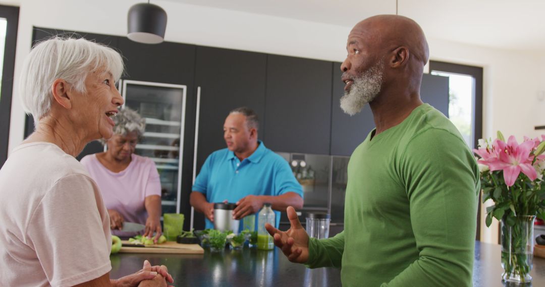 Group of Diverse Seniors Socializing in Modern Kitchen Setting - Free Images, Stock Photos and Pictures on Pikwizard.com