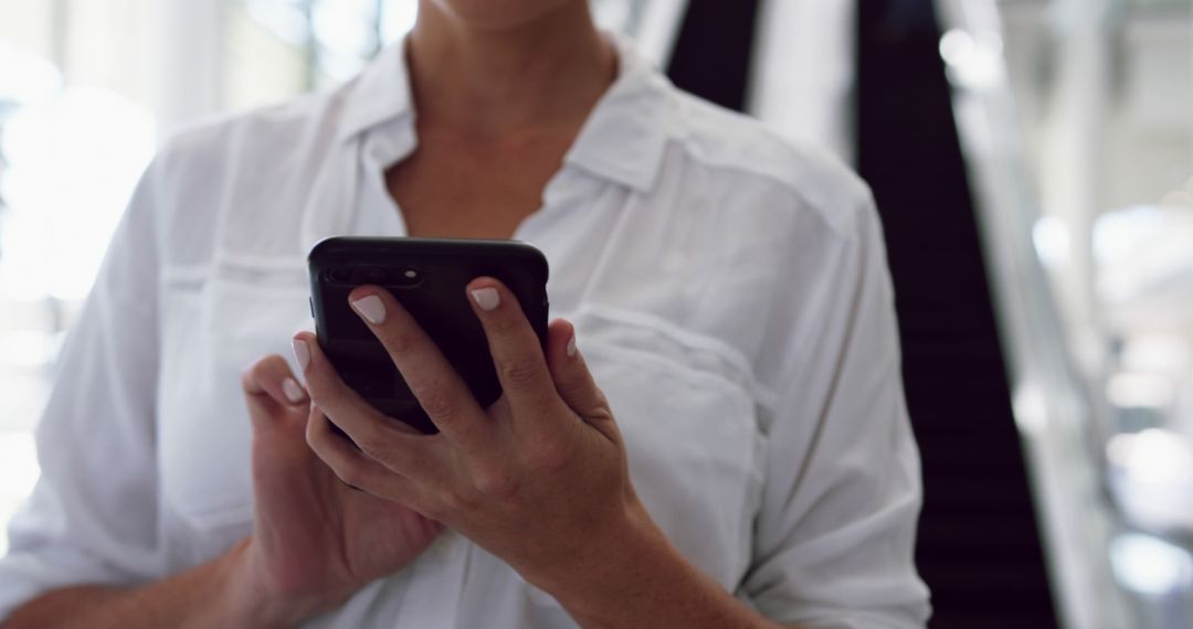 Close-up of Woman Using Smartphone in Indoor Setting - Free Images, Stock Photos and Pictures on Pikwizard.com