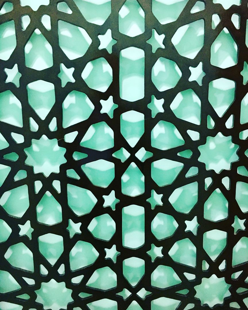 Close-Up of Geometric Star Pattern on Green Background - Free Images, Stock Photos and Pictures on Pikwizard.com
