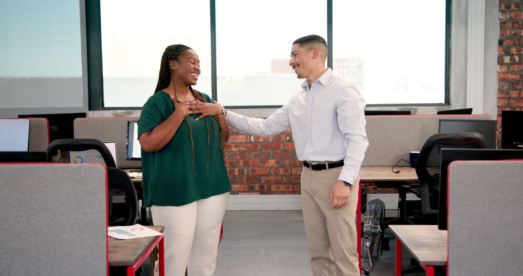 Colleagues Sharing Success in Modern Office