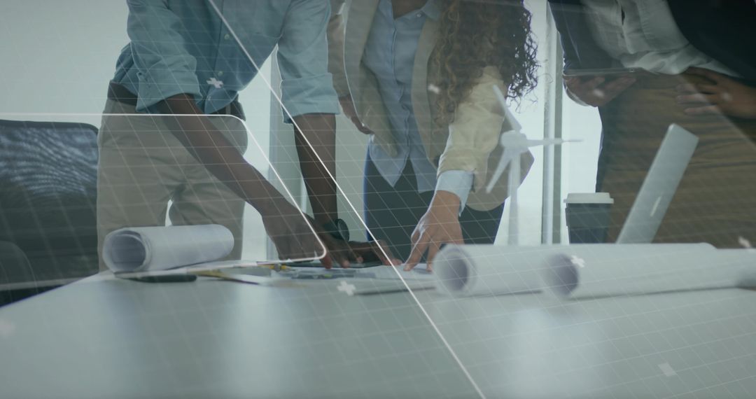 Professionals Collaborating Over Architectural Blueprints