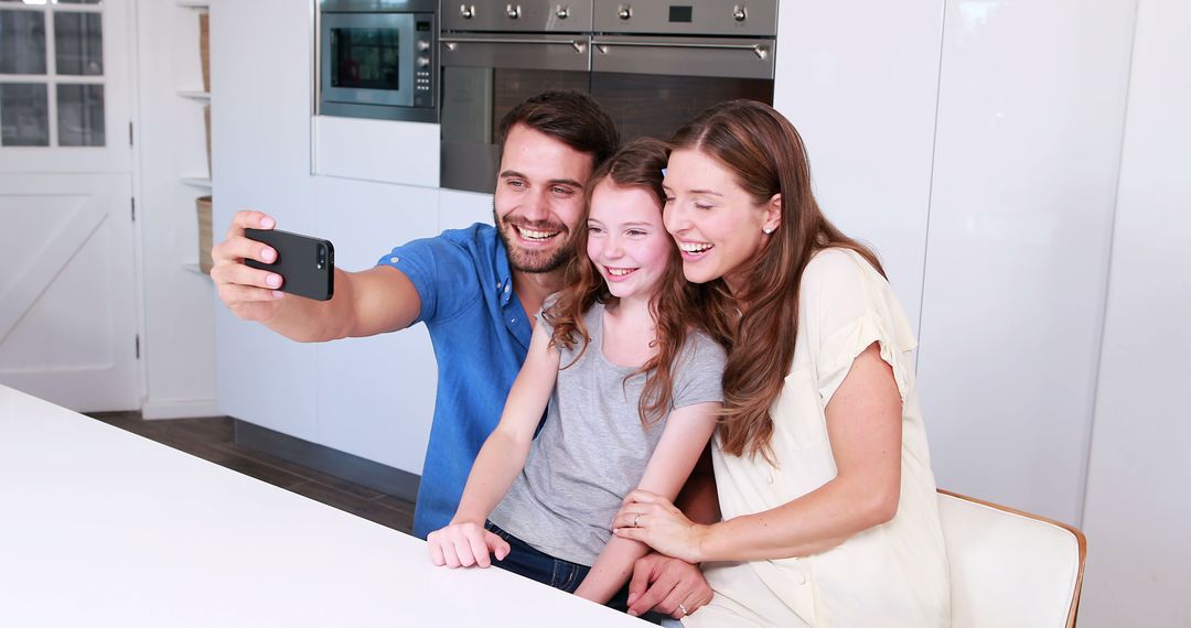 Happy Family Taking Selfie in Modern Kitchen - Free Images, Stock Photos and Pictures on Pikwizard.com