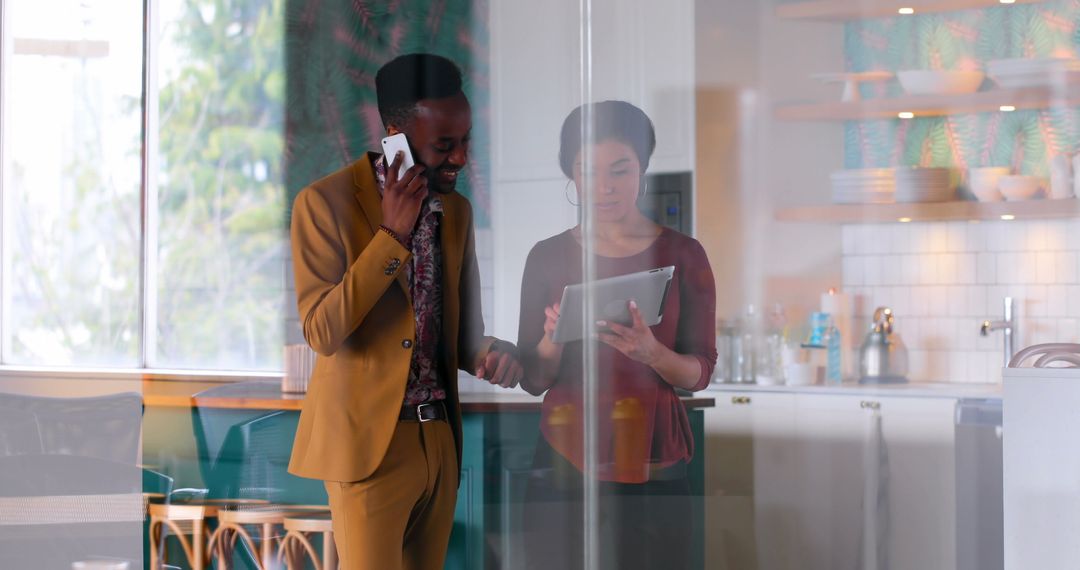 Colleagues Collaborating on Digital Project in Modern Office