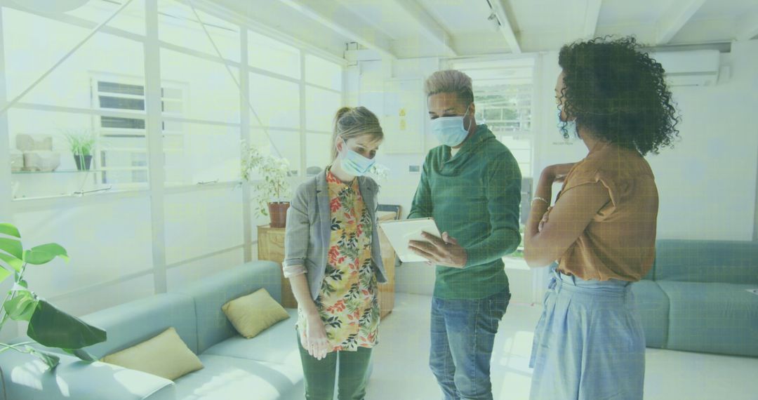 Business Professionals Collaborating with Technology and Safety Measures