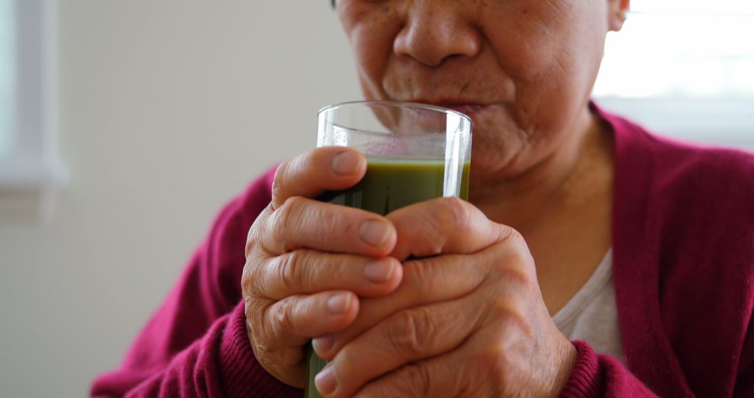 Elderly Woman Drinking Green Vegetable Smoothie - Free Images, Stock Photos and Pictures on Pikwizard.com