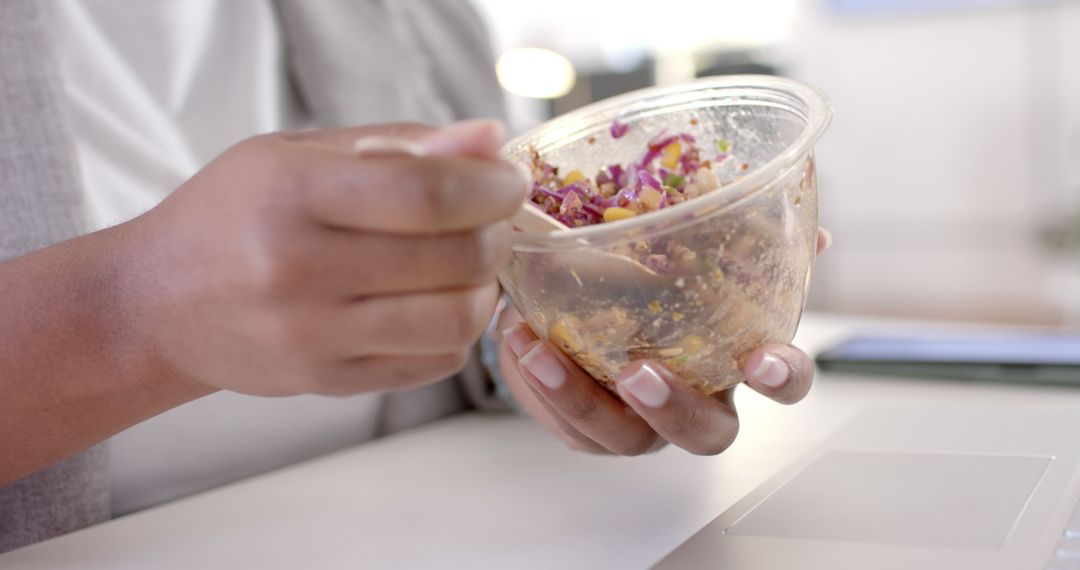 Hands Holding Bowl of Healthy Salad at Work Desk - Free Images, Stock Photos and Pictures on Pikwizard.com