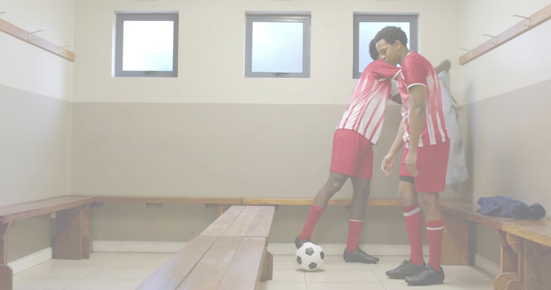 Soccer Teammates Consoling in Locker Room Showing Team Support and Postgame Camaraderie