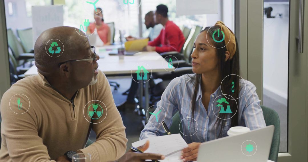 Diverse Team Discussing Technology and Sustainability in Modern Office