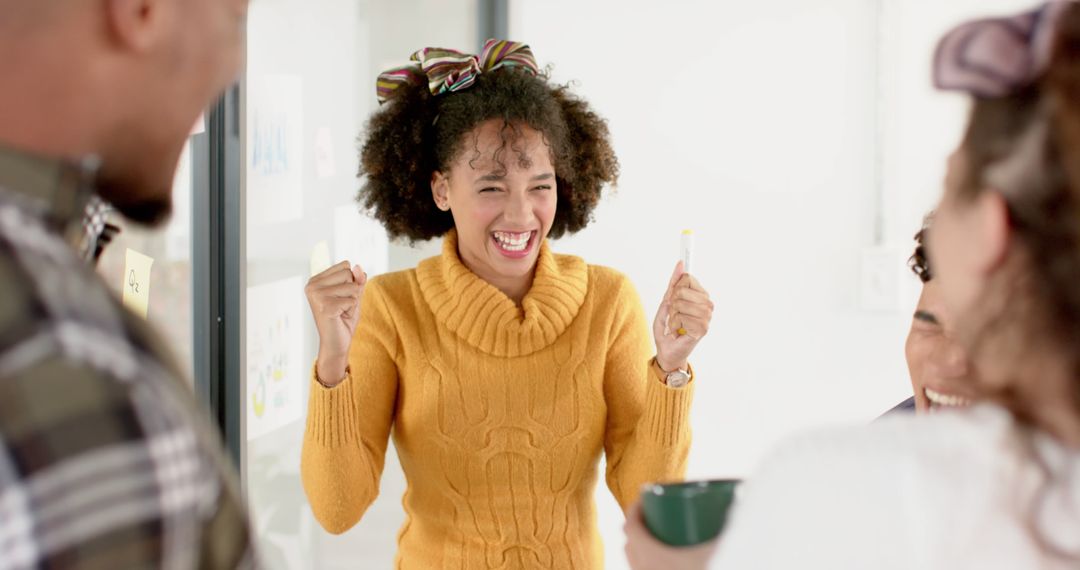 Ecstatic Young Woman Celebrating Success in Group Meeting - Free Images, Stock Photos and Pictures on Pikwizard.com