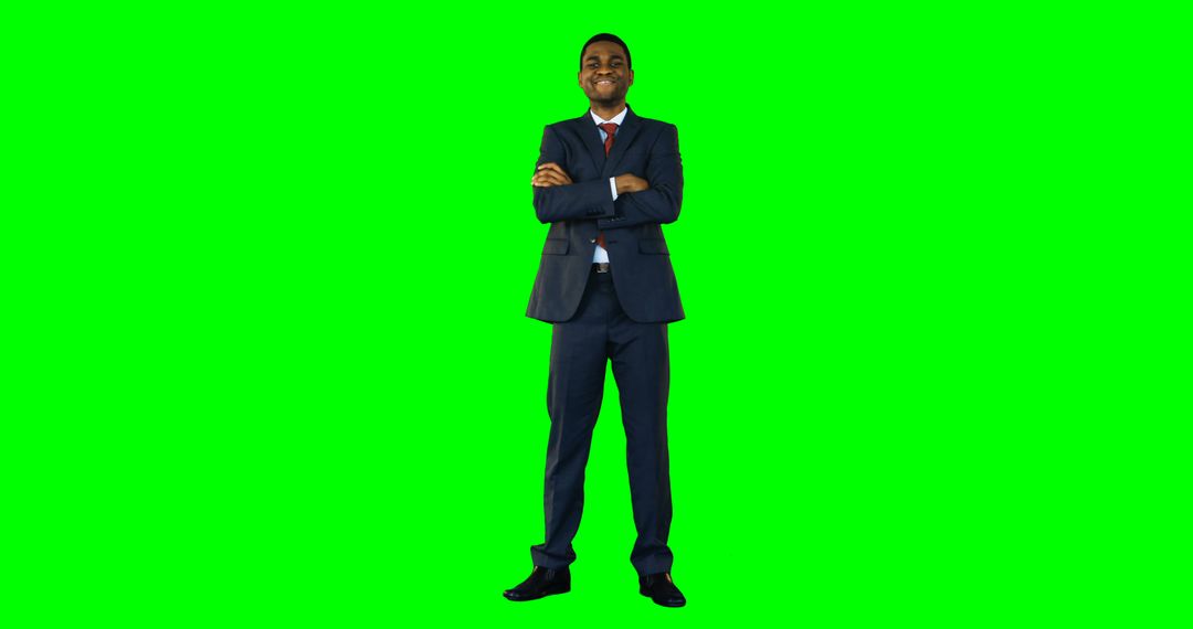 Confident Businessman Smiling with Arms Crossed on Green Chroma Key Background - Free Images, Stock Photos and Pictures on Pikwizard.com