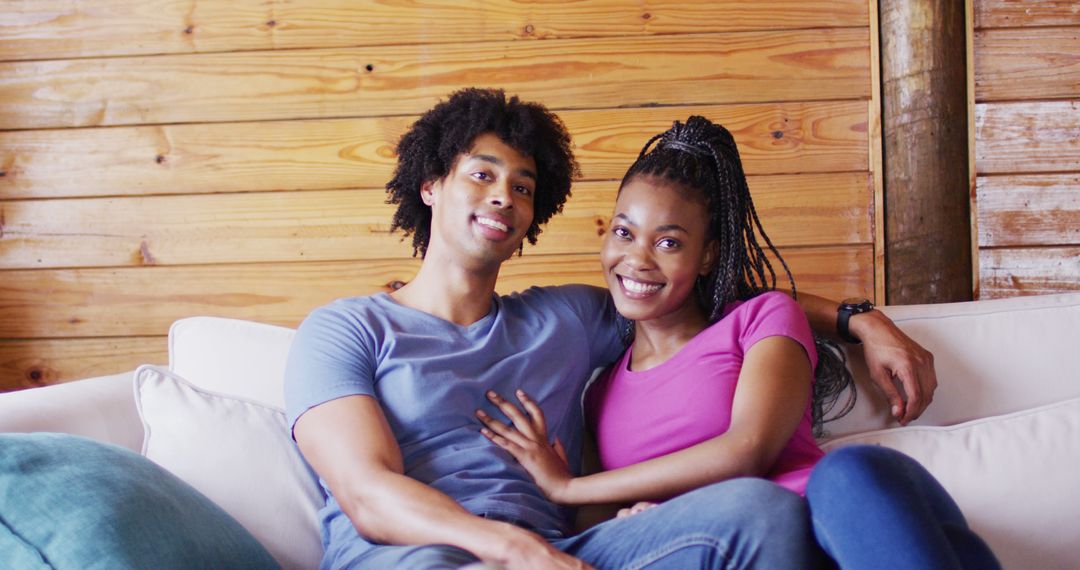 Happy Couple Embracing in Rustic Log Cabin Setting
