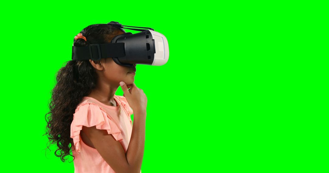 Young Girl Using VR Headset with Green Screen Background - Free Images, Stock Photos and Pictures on Pikwizard.com