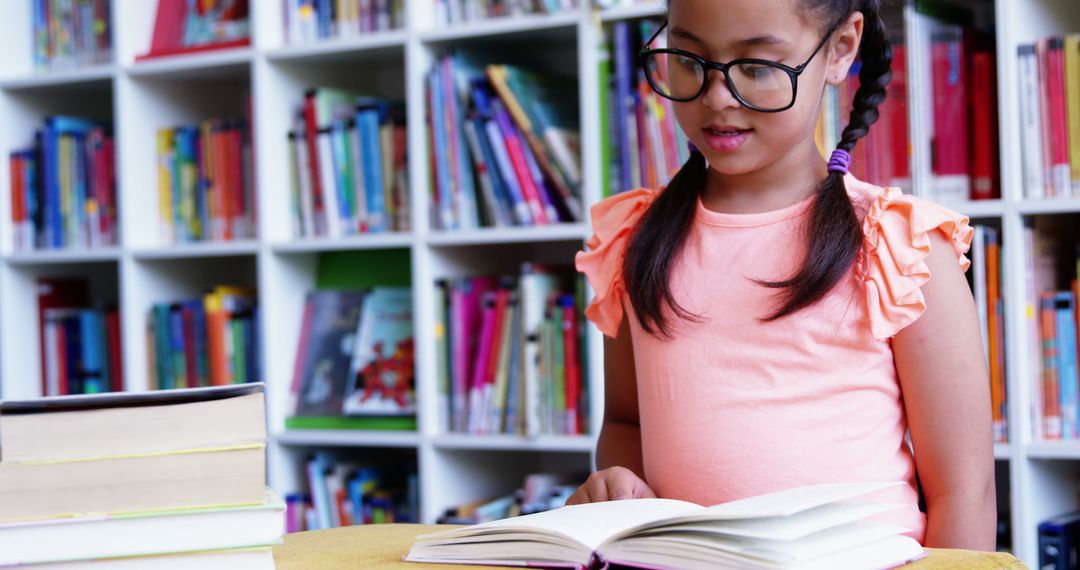 Young Girl Reading in Library