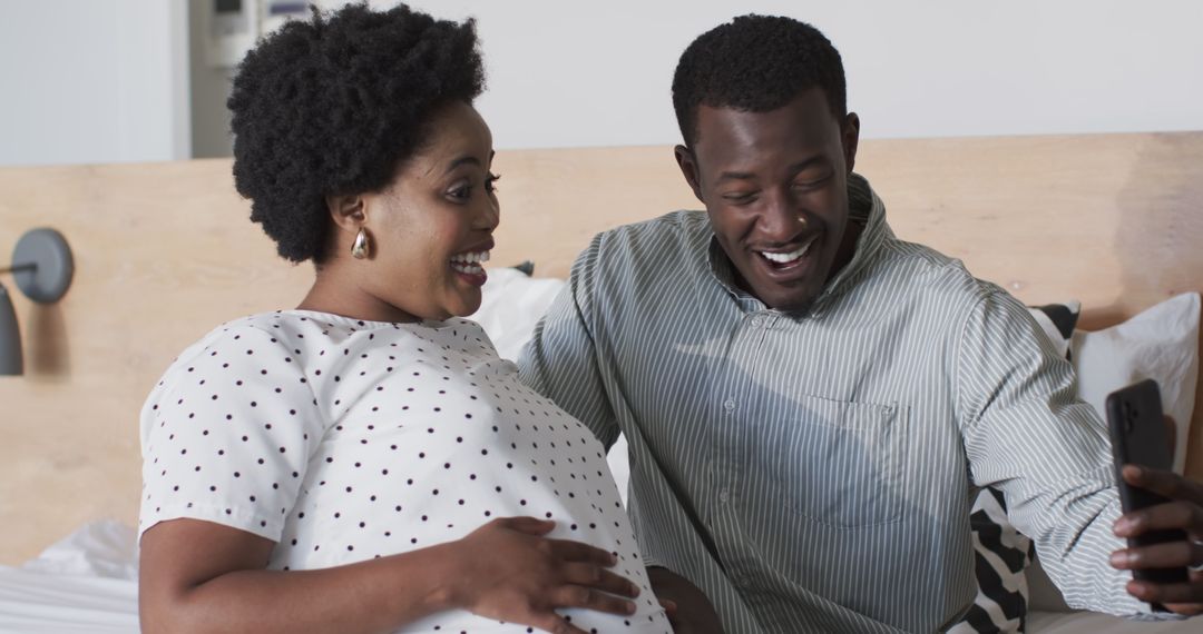 Excited Couple Taking Selfie, Embracing New Parenthood Journey