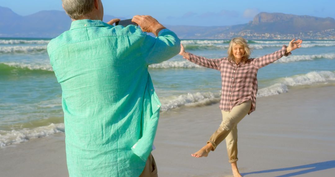 Senior Couple Enjoying Leisurely Day at Ocean Beach