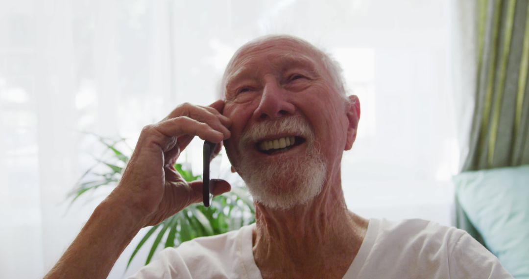 Elderly Man Enjoying Phone Call at Retirement Home