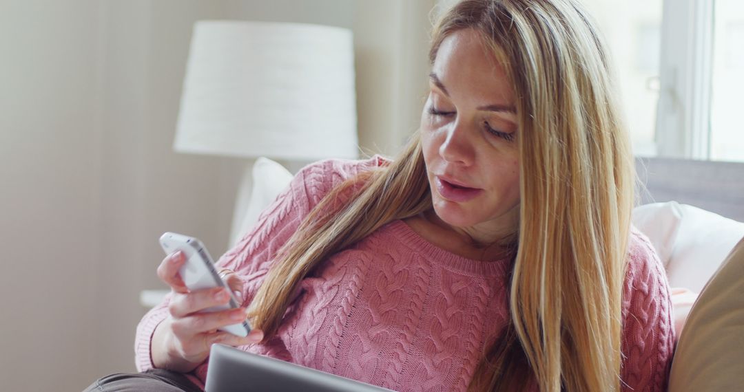 Woman Using Smartphone and Tablet on Couch at Home - Free Images, Stock Photos and Pictures on Pikwizard.com