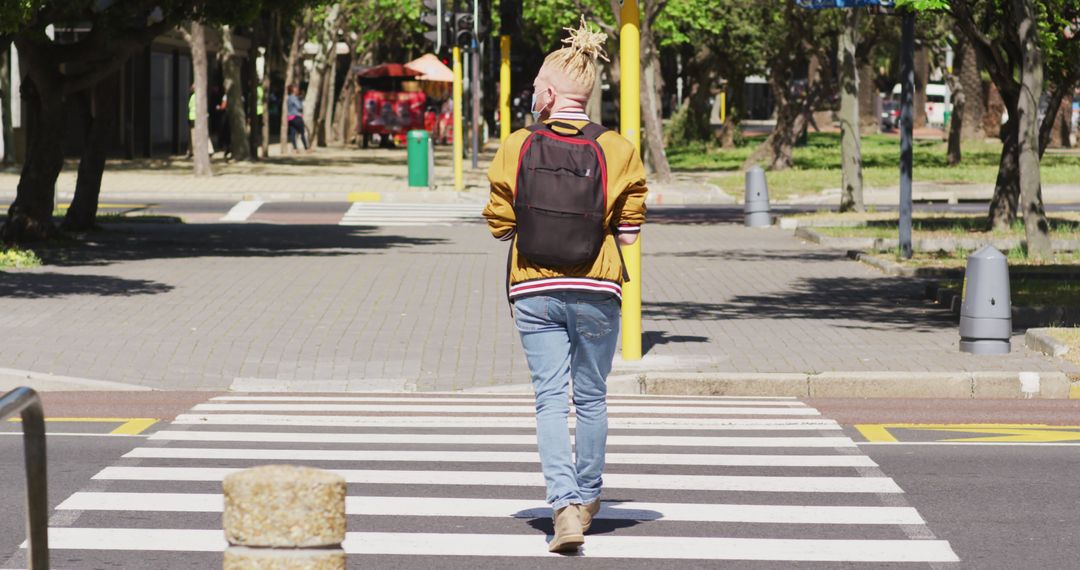 Albino Man with Dreadlocks Crossing City Street