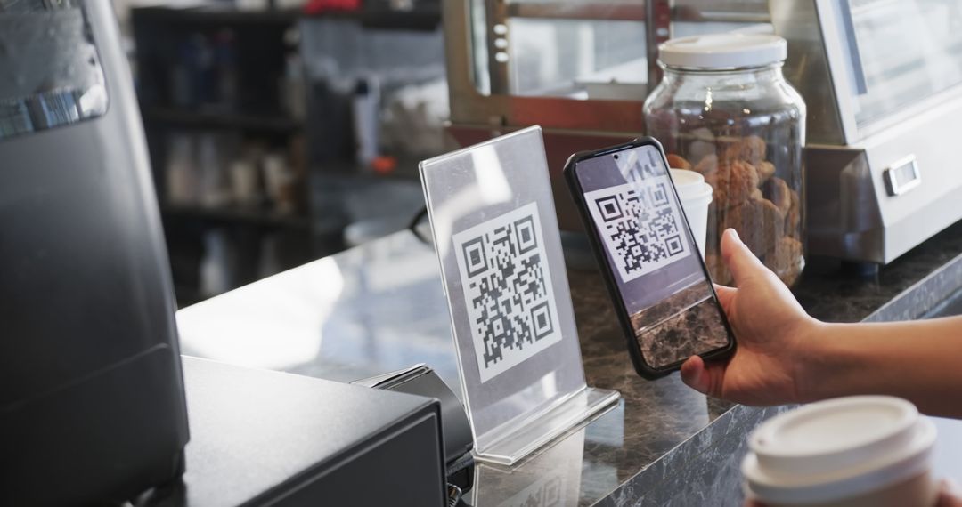 Person Making Payment with QR Code at Coffee Shop Counter - Free Images, Stock Photos and Pictures on Pikwizard.com