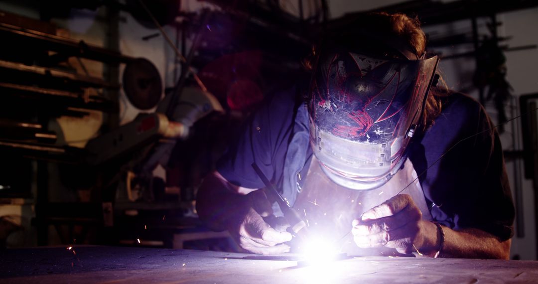 Metalworker Welding in Darkness with Intense Light and Sparks - Free Images, Stock Photos and Pictures on Pikwizard.com