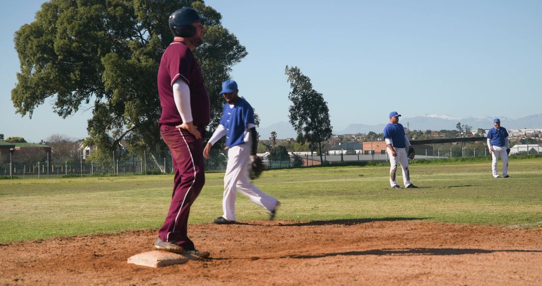 Baseball Players Engaging on Sharp Green Sport Field