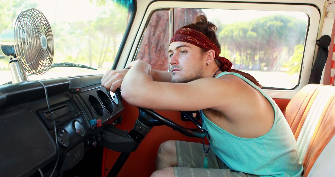 Young Man Relaxing in Vintage Van for Road Trip Adventure - Free Images, Stock Photos and Pictures on Pikwizard.com