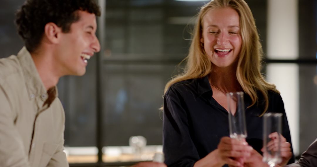 Colleagues Sharing Drinks at Office Night Gathering Enjoying Celebration