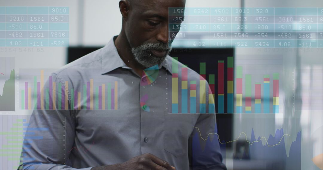 Focused Man Analyzing Financial Data with Digital Graphs