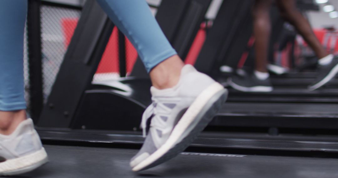 People Running on Treadmill for Indoor Fitness Routine