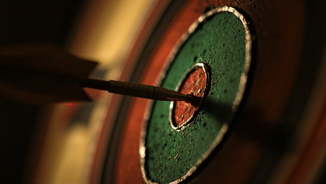 Metal Dart Hitting Bullseye on Vintage Dartboard
