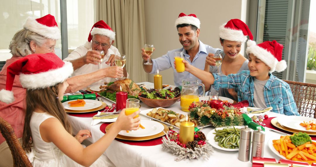 Family Celebrating Christmas Dinner with Santa Hats Toasting Around Festive Table - Free Images, Stock Photos and Pictures on Pikwizard.com