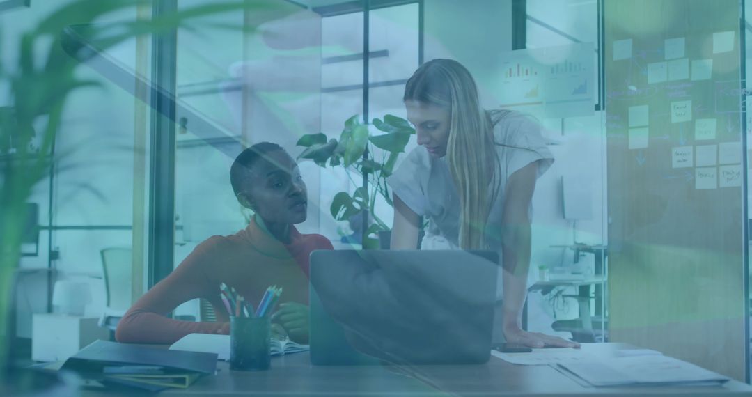 Office Professionals Collaborating on Report with Laptop